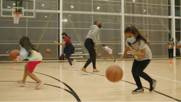 Girl dribbling basketball